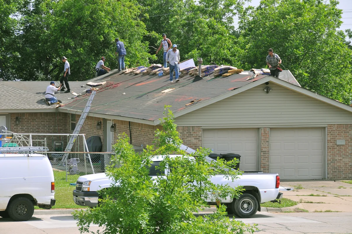 Roofing crew replacing the roof on a Wichita home